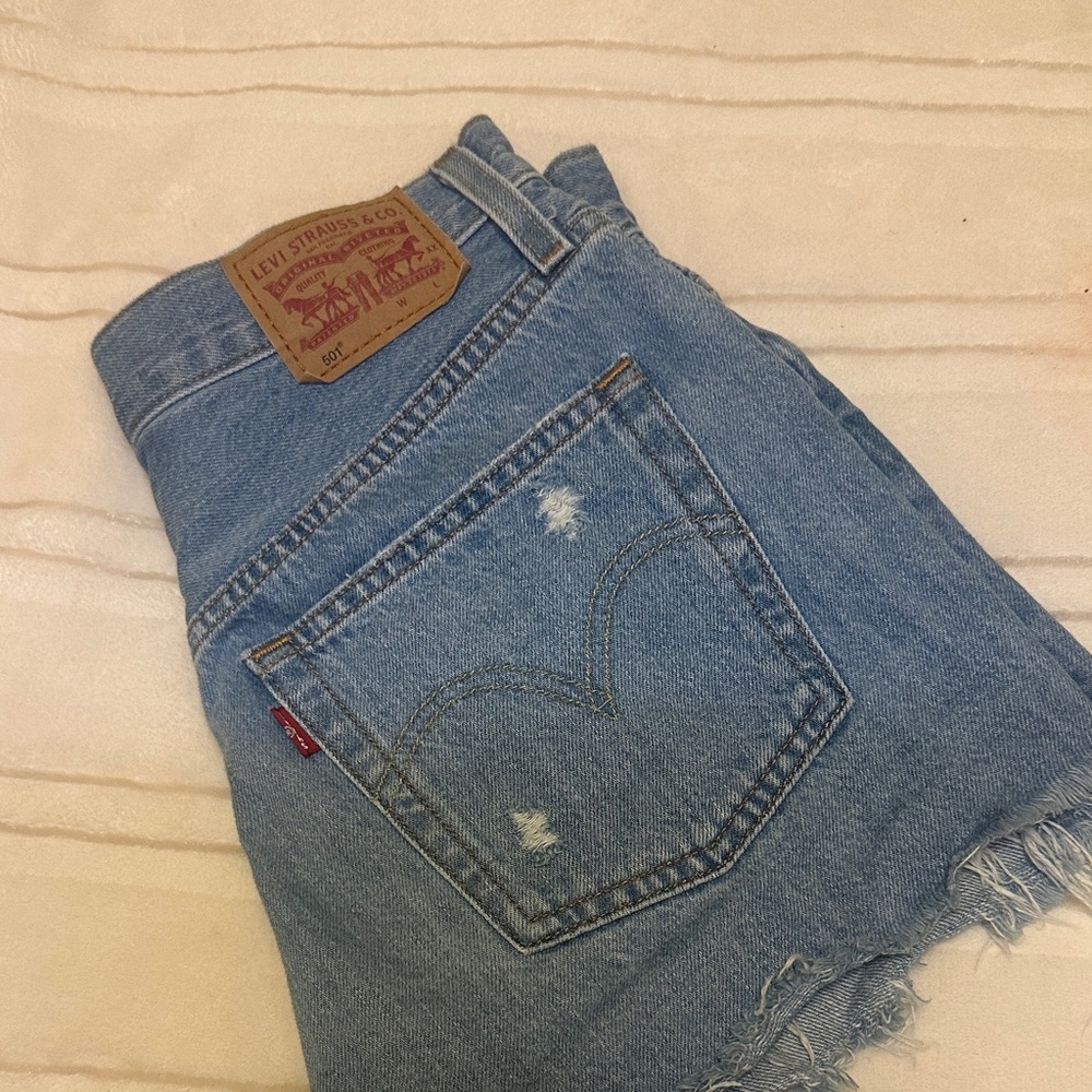 501 Levi Light Blue Distressed Denim Shorts